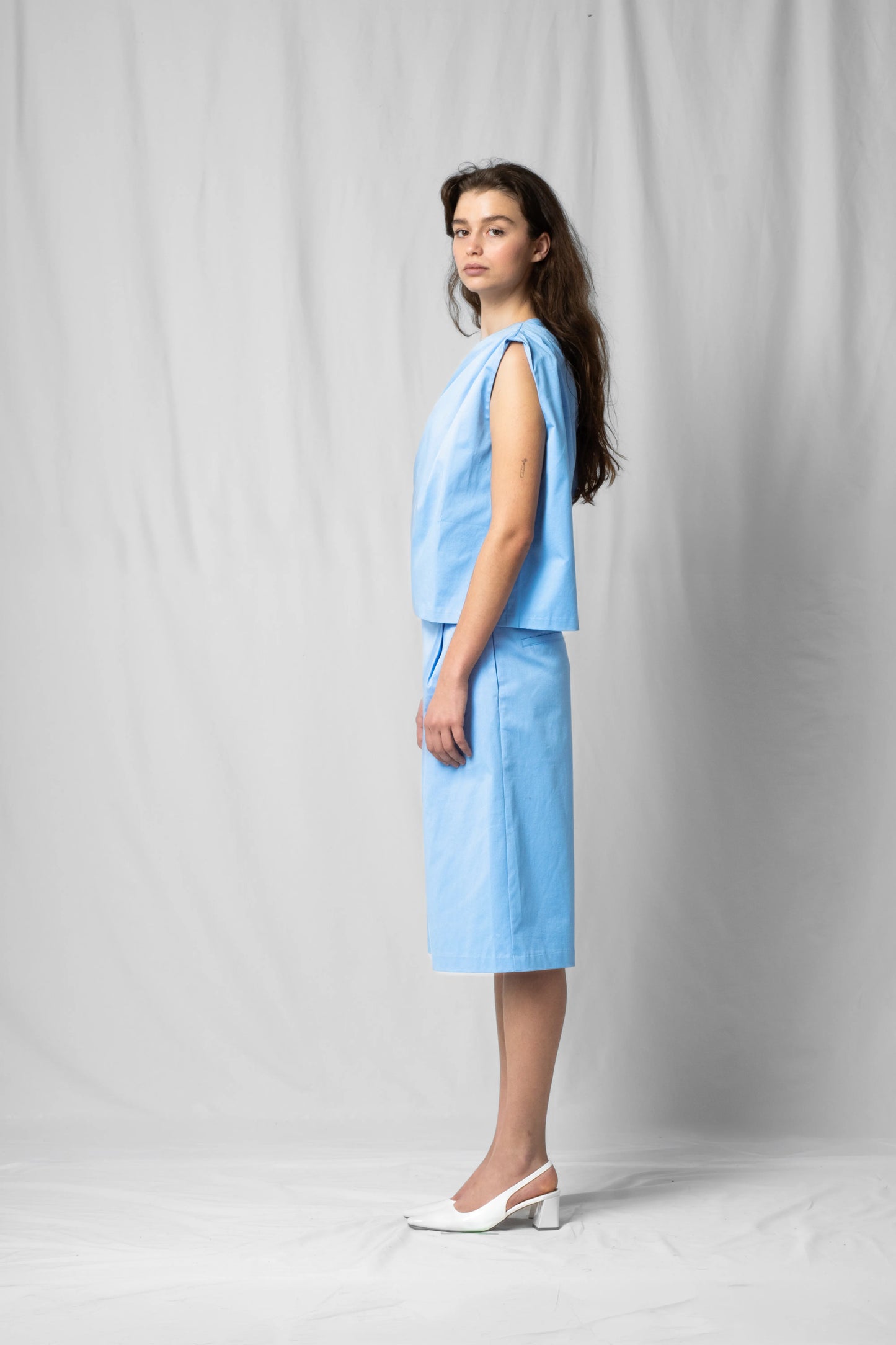 Ciel blue Asymmetric off-shoulder top bea with pleated detailing from the SS26 collection by STEF SERIES