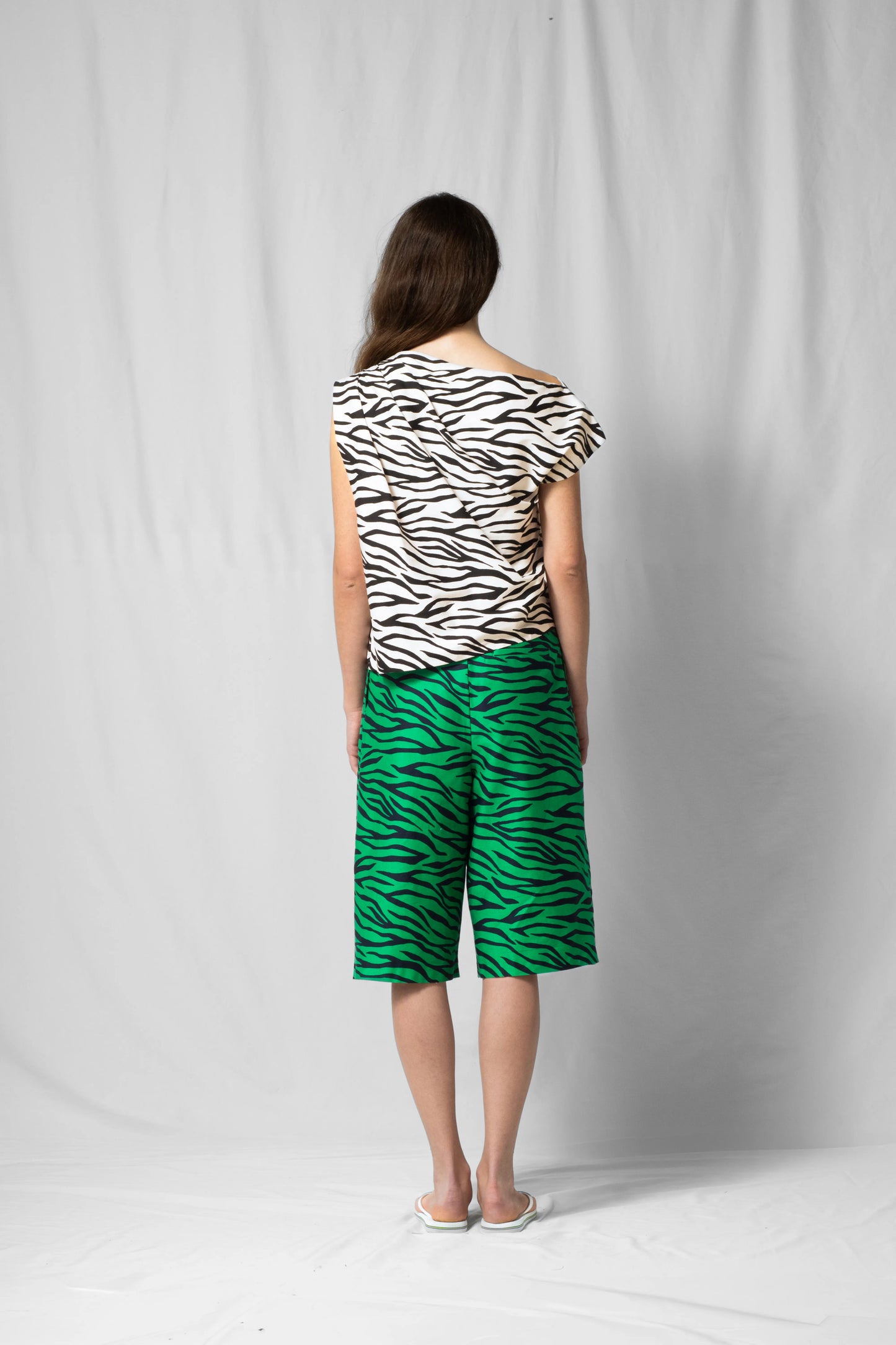 White zebra Asymmetric off-shoulder top bea with pleated detailing from the SS26 collection by STEF SERIES