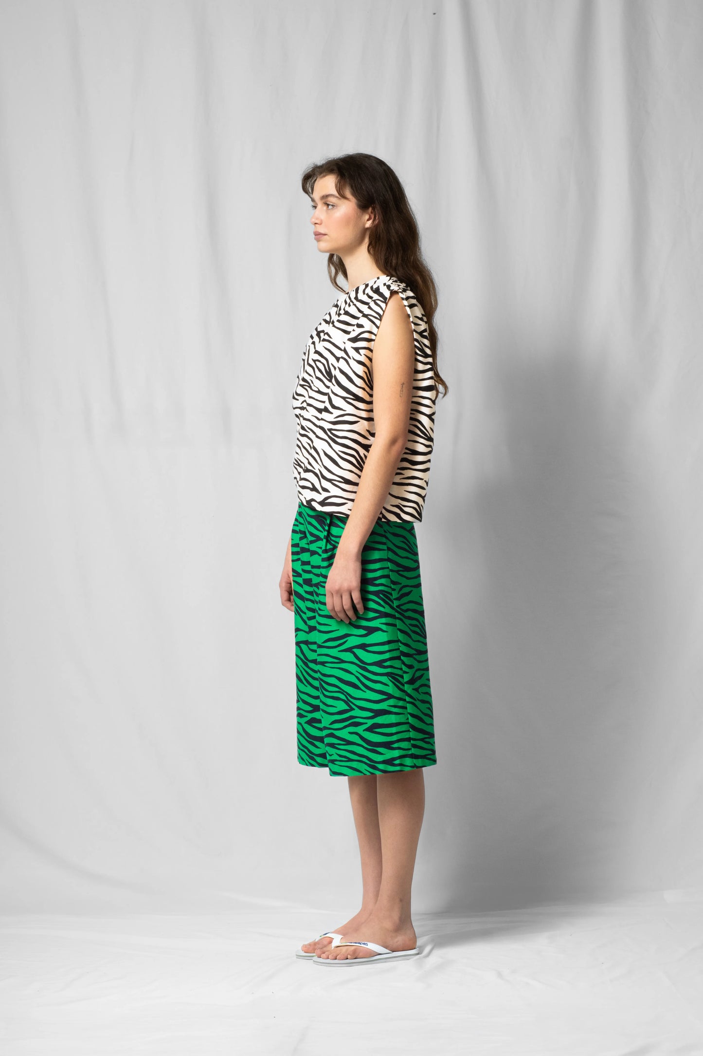 White zebra Asymmetric off-shoulder top bea with pleated detailing from the SS26 collection by STEF SERIES