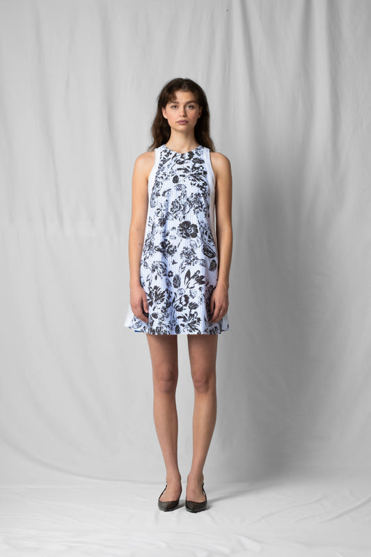 Short, wide black flowers halter dress with a two-fabric detail and button fastening at the back from the SS26 collection by STEF SERIES