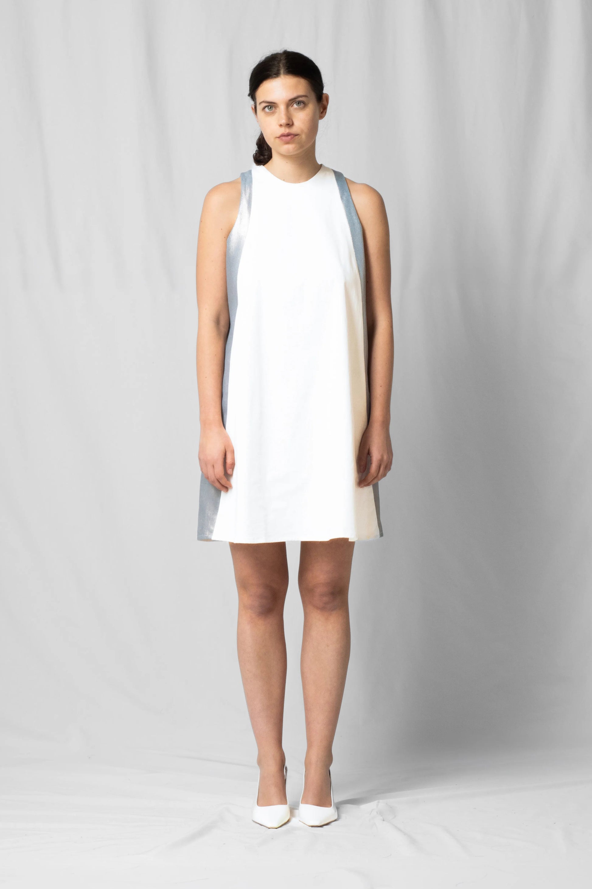 Short, wide ecru halter dress with a two-fabric detail and button fastening at the back from the SS26 collection by STEF SERIES