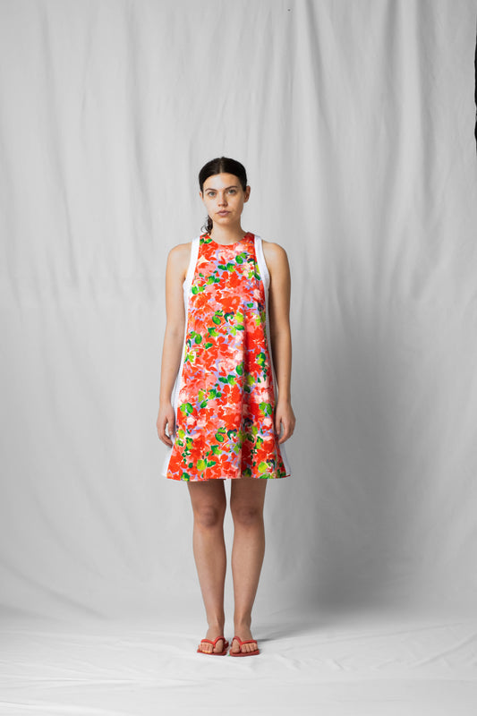 Short, wide pink flowers halter dress with a two-fabric detail and button fastening at the back from the SS26 collection by STEF SERIES