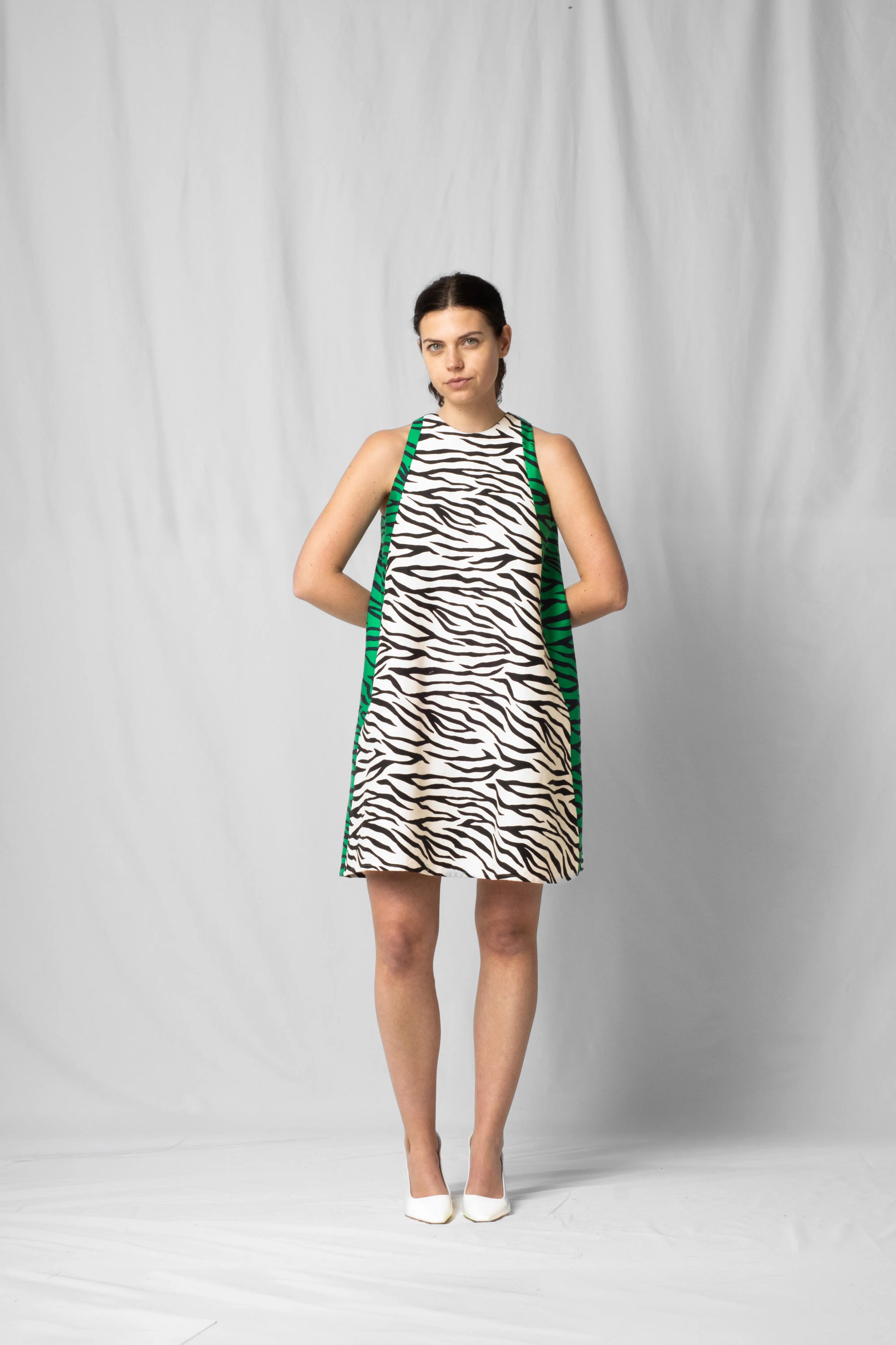 Short, wide white zebra halter dress with a two-fabric detail and button fastening at the back from the SS26 collection by STEF SERIES