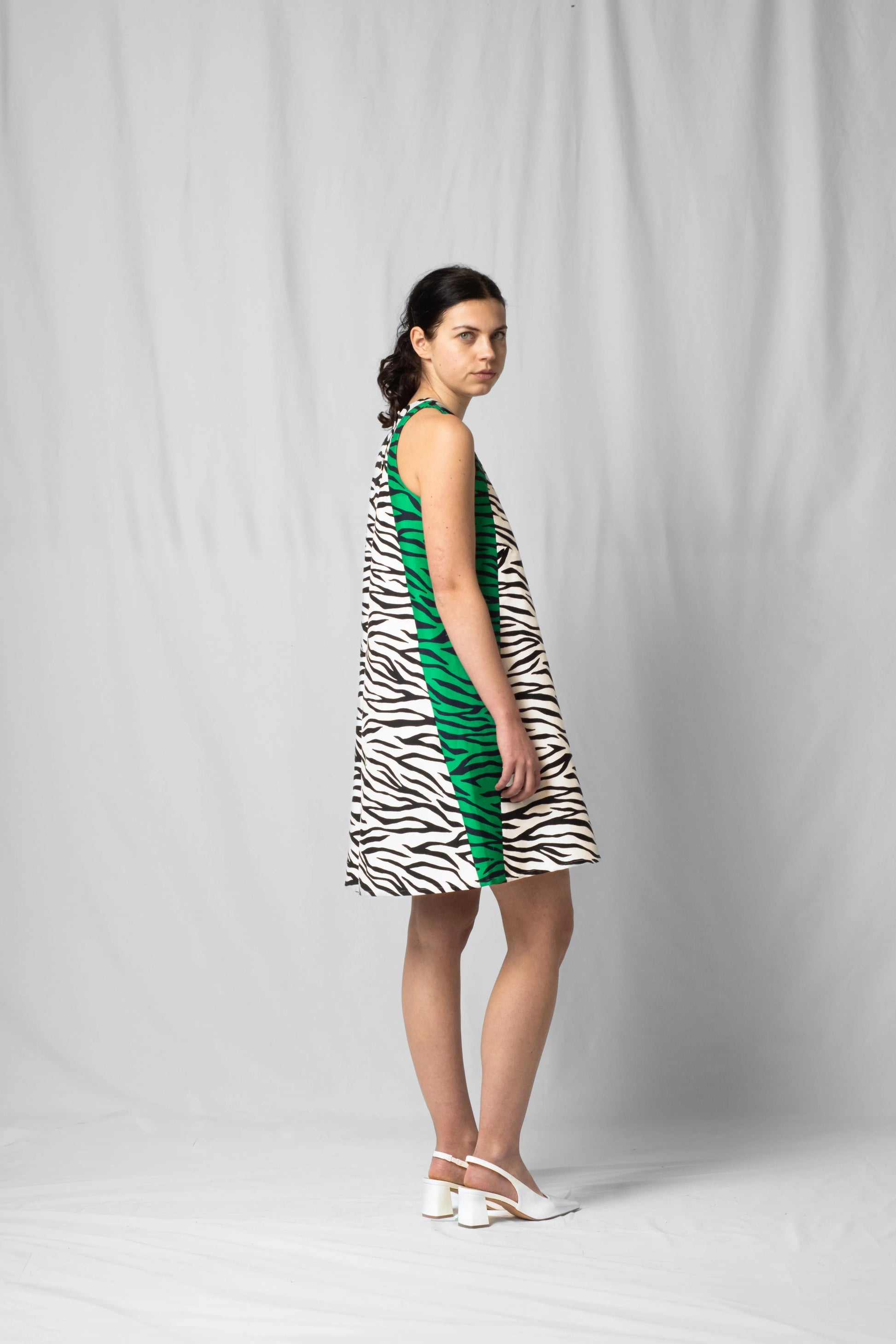 Short, wide white zebra halter dress with a two-fabric detail and button fastening at the back from the SS26 collection by STEF SERIES