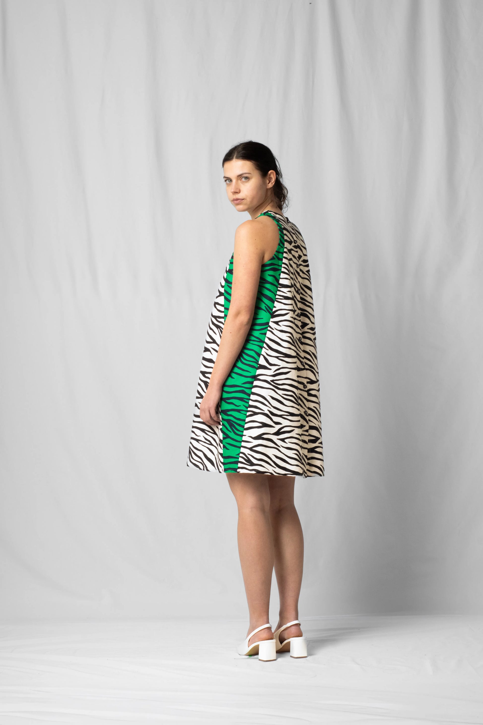 Short, wide white zebra halter dress with a two-fabric detail and button fastening at the back from the SS26 collection by STEF SERIES