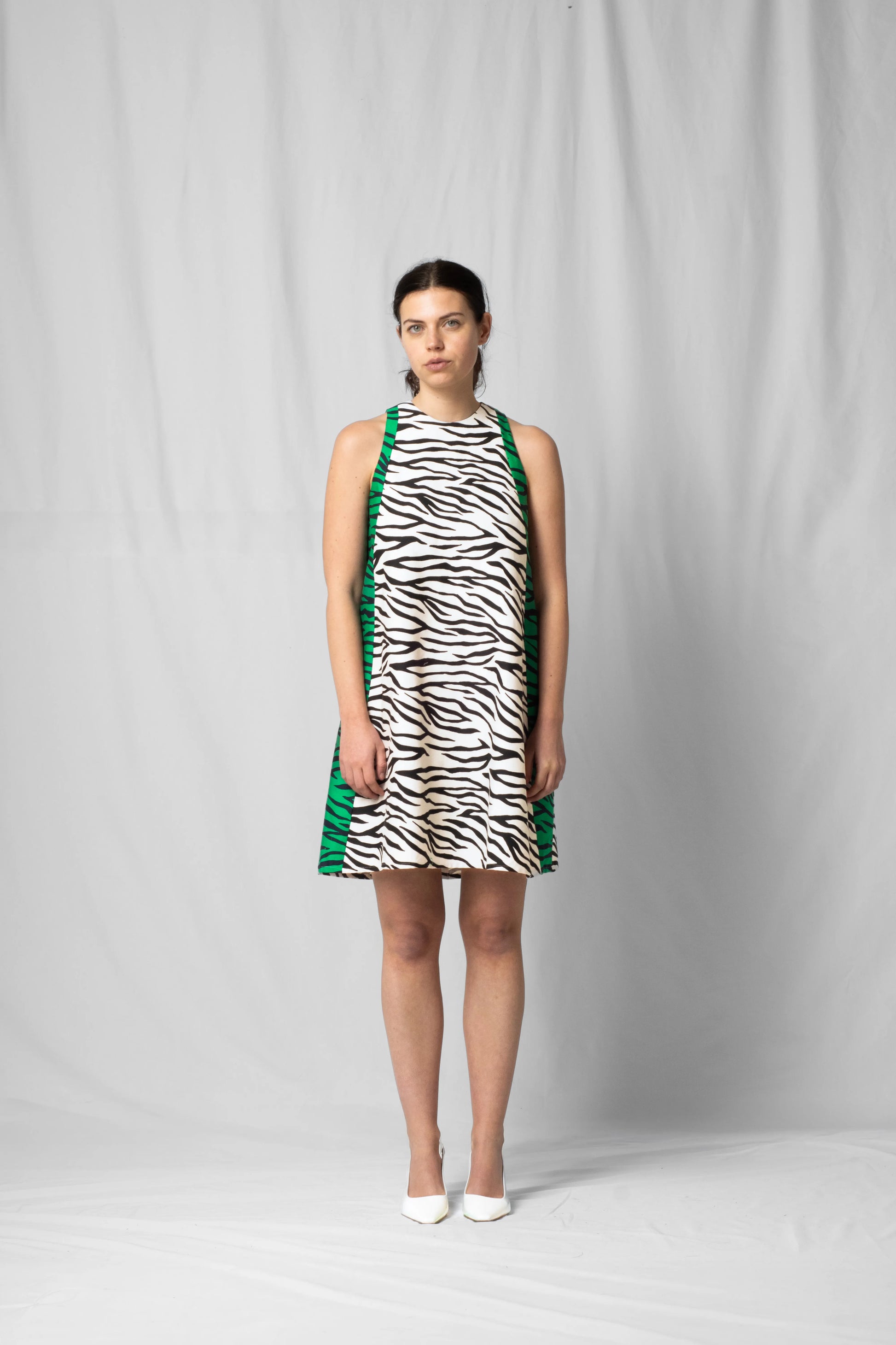Short, wide white zebra halter dress with a two-fabric detail and button fastening at the back from the SS26 collection by STEF SERIES