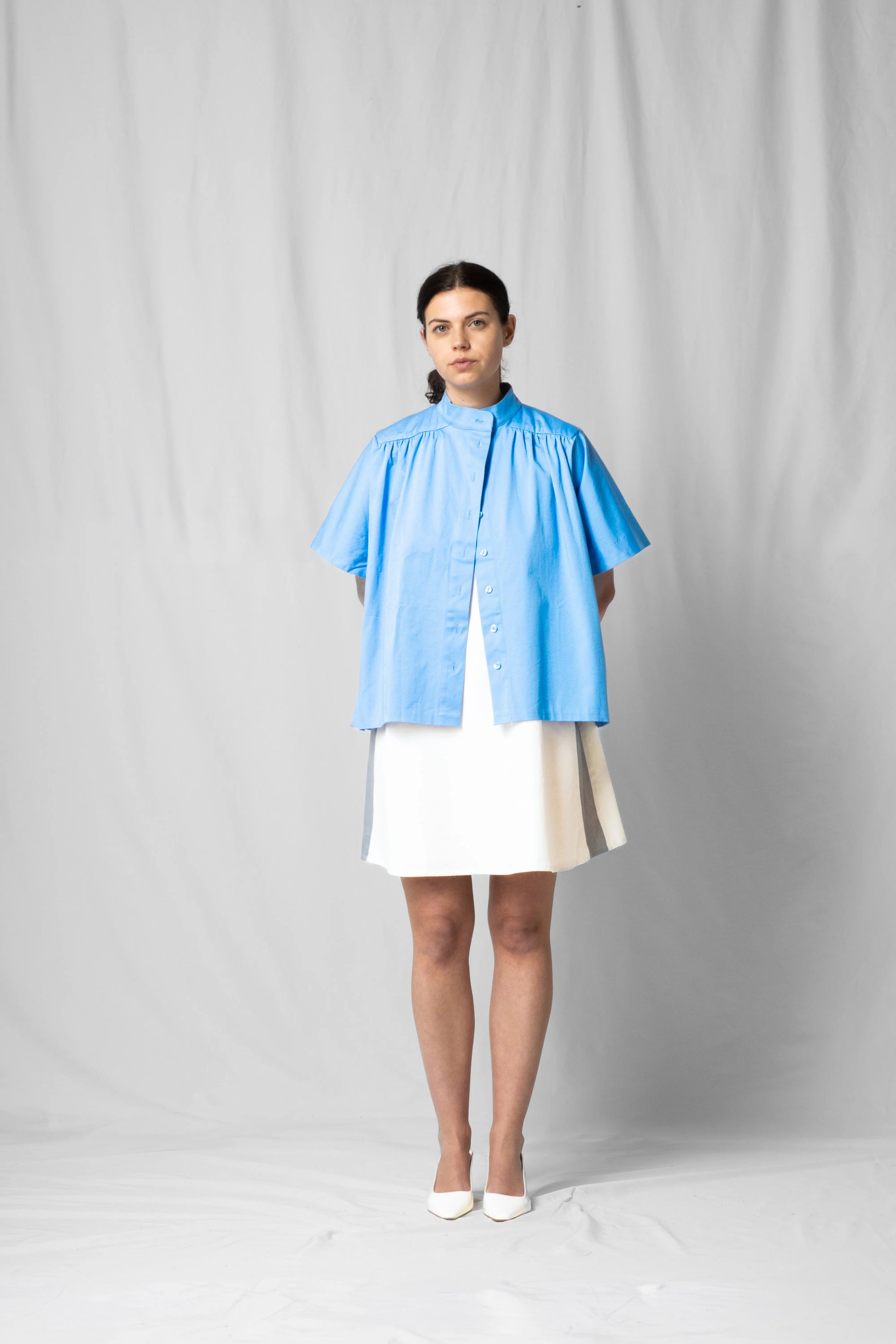 Ciel blue short-sleeve Bowie shirt with button fastening and gathered detailing from the SS26 collection by STEF SERIES shown from the front.