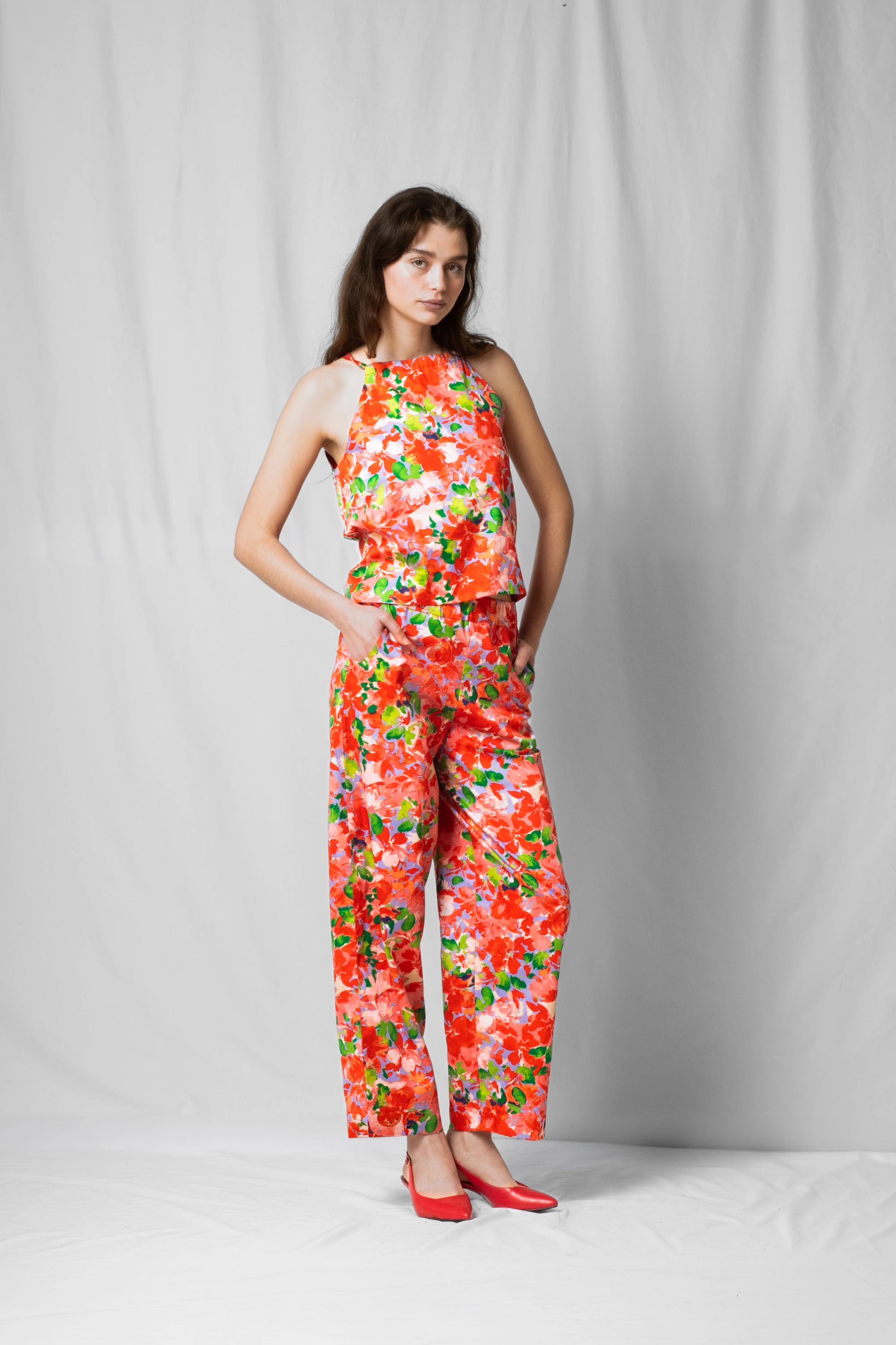 Model wearing Belle halter top in pink flowers from the limited SS26 collection with number pieces by STEF SERIES.